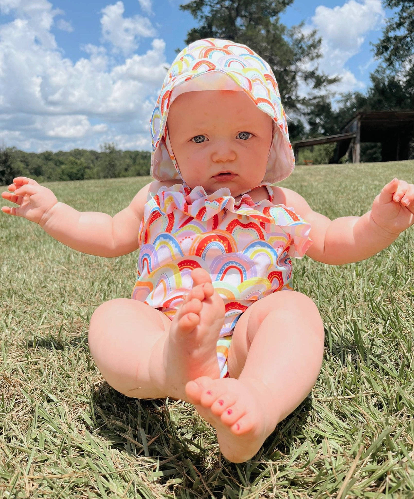 Kaia joined the competition — help win amazing prizes! baby, baby_toddler_clothing, cloud, facial_expression, finger, fun, grass, hand, happy, headwear, leaf, leisure, people_in_nature, person, pink, plant, skin, sky, summer, thumb