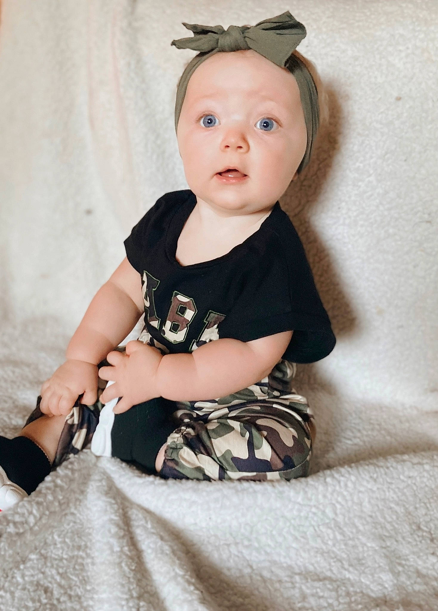 Kaia joined the competition — help win amazing prizes! arm, baby, baby_toddler_clothing, child, cool, eyelash, face, flash_photography, hairstyle, hat, head, iris, neck, pattern, person, shoulder, skin, sleeve, standing, surprise