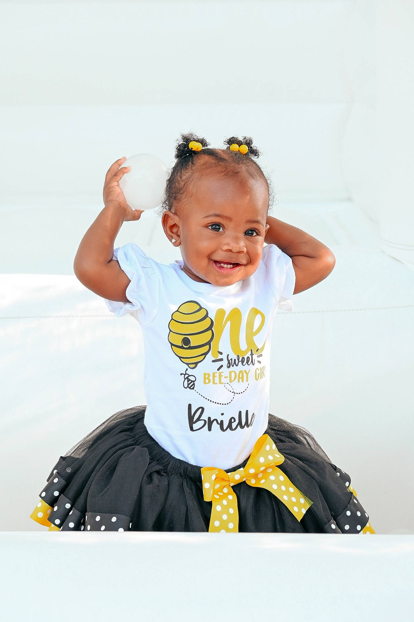 Brielle joined the competition — help win amazing prizes! baby, baby_toddler_clothing, child, costume, fashion_accessory, flash_photography, font, fun, happy, hat, jewellery, joy, person, personal_protective_equipment, recreation, sitting, sleeve, smile, sportswear, t_shirt