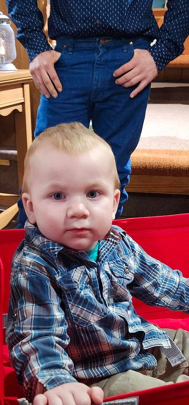 Hardyn is registered to the contest to win money with this photo: baby, blue, chair, cheek, child, clothing, couch, denim, event, fun, lap, leisure, pattern, person, plaid, room, sitting, table, tartan, toddler