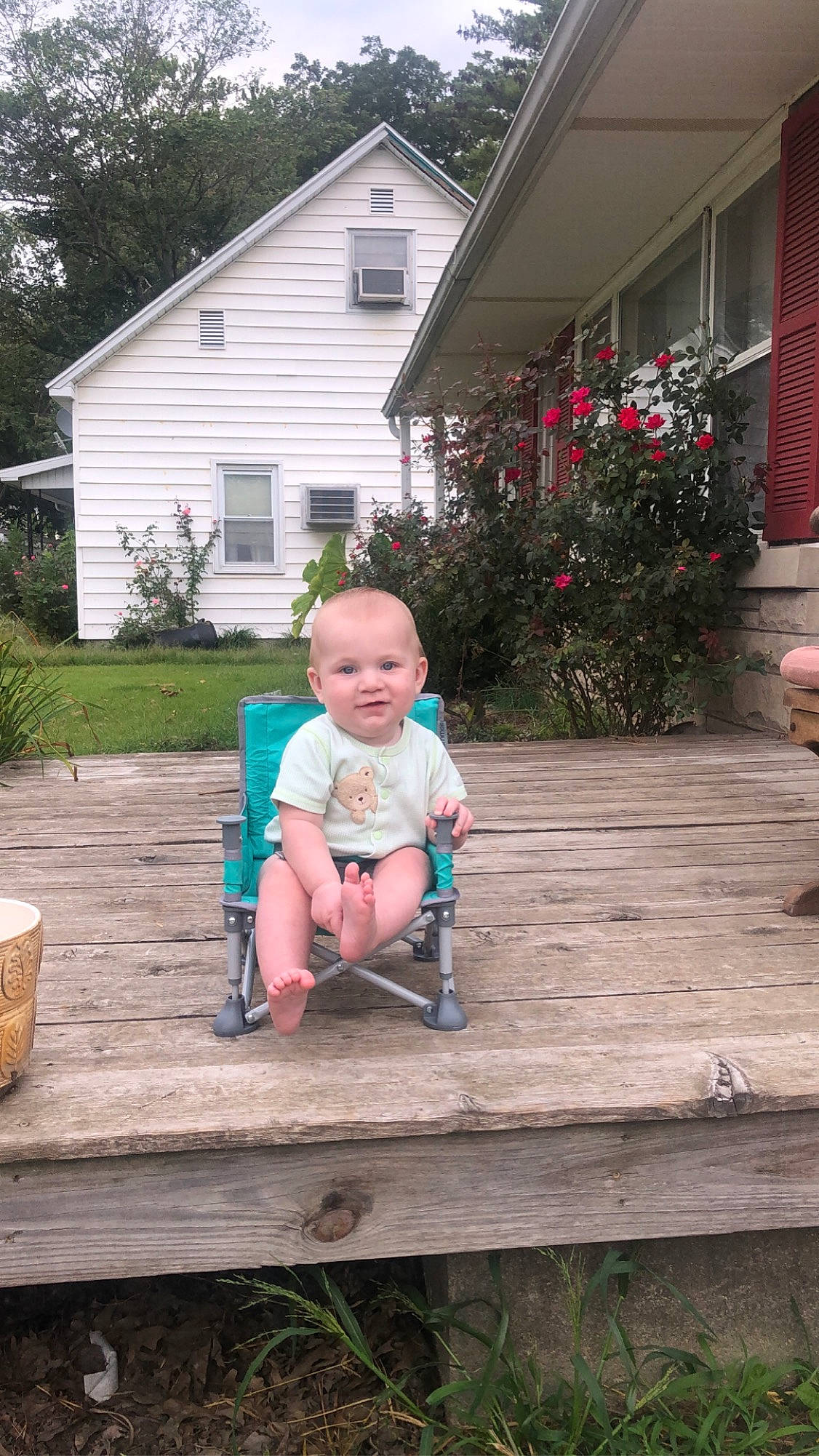 Hardyn joined the competition — help win amazing prizes! baby, baby_toddler_clothing, building, cottage, deck, flooring, grass, hardwood, house, joy, leisure, outdoor_furniture, person, plant, recreation, siding, sitting, summer, toddler, tree