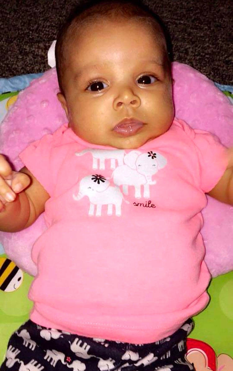 Myla joined the competition — help win amazing prizes! abdomen, baby_products, cheek, child, day, eye, face, girl, head, infant, iris, lip, mouth, nose, person, pink, product, sitting, skin, smile