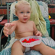 Laiklyn joined the competition — help win amazing prizes! toddler, child, outdoor, flower_petals, basket, blue_eyes, diaper, lounge_chair, blanket, curly_hair, summer, garden, backyard, person, relaxing, skin, hand, nature, daytime, casual
