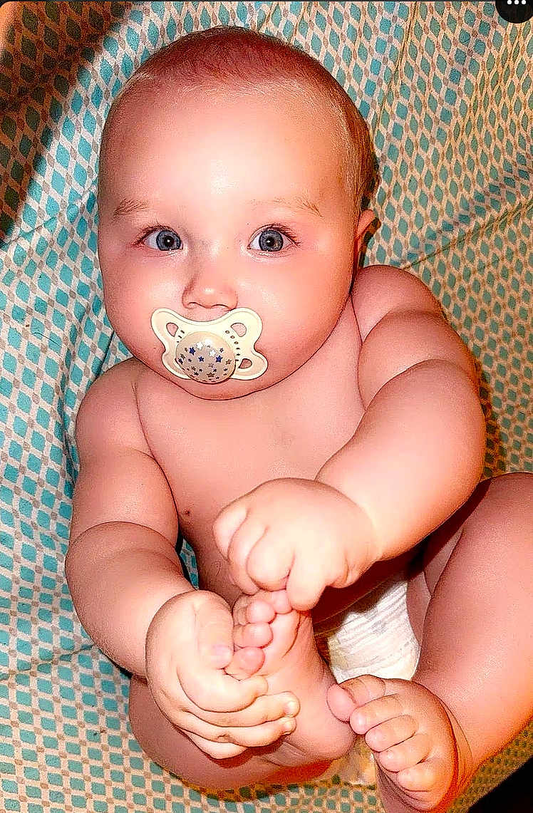 Laiklyn joined the competition — help win amazing prizes! baby, infant, pacifier, blue_eyes, bare_skin, hand, foot, toes, diaper, patterned_blanket, cute, chubby, child, sitting, grabbing, close_up, skin, face, expression, indoors