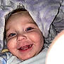 Laiklyn is registered to the contest to win money with this photo: baby, smiling, face, blue_eyes, blanket, soft_texture, teeth, infant, close_up, happy, child, cute, cozy, wrapped, portrait, skin, clothing, expression, indoors, toddler