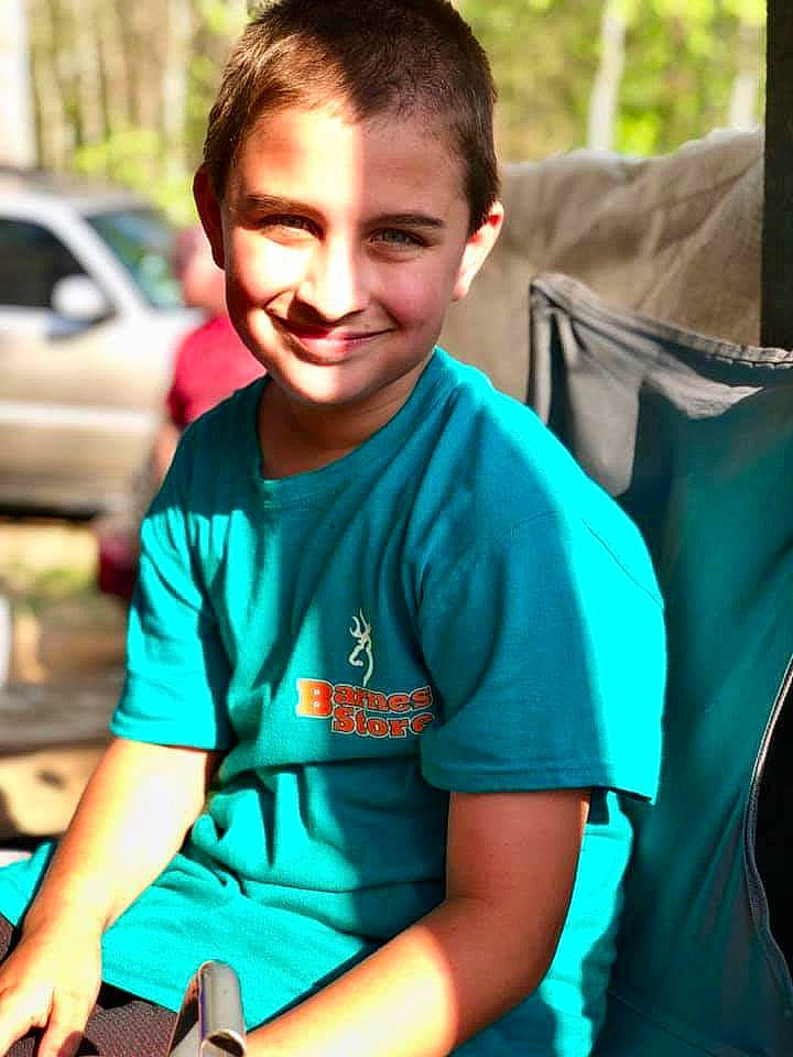 Dusty is registered to the contest to win money with this photo: child, green, joy, leisure, person, recreation, smile, style, t_shirt, turquoise, vacation, youth