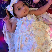 Zayelle joined the competition — help win amazing prizes! baby, child, dress, headband, bow, easter_eggs, stuffed_bunny, colorful_background, lying_down, cute, infant, portrait, soft_toys, holiday_theme, happy, smiling, indoors, decorations, playful, adorable