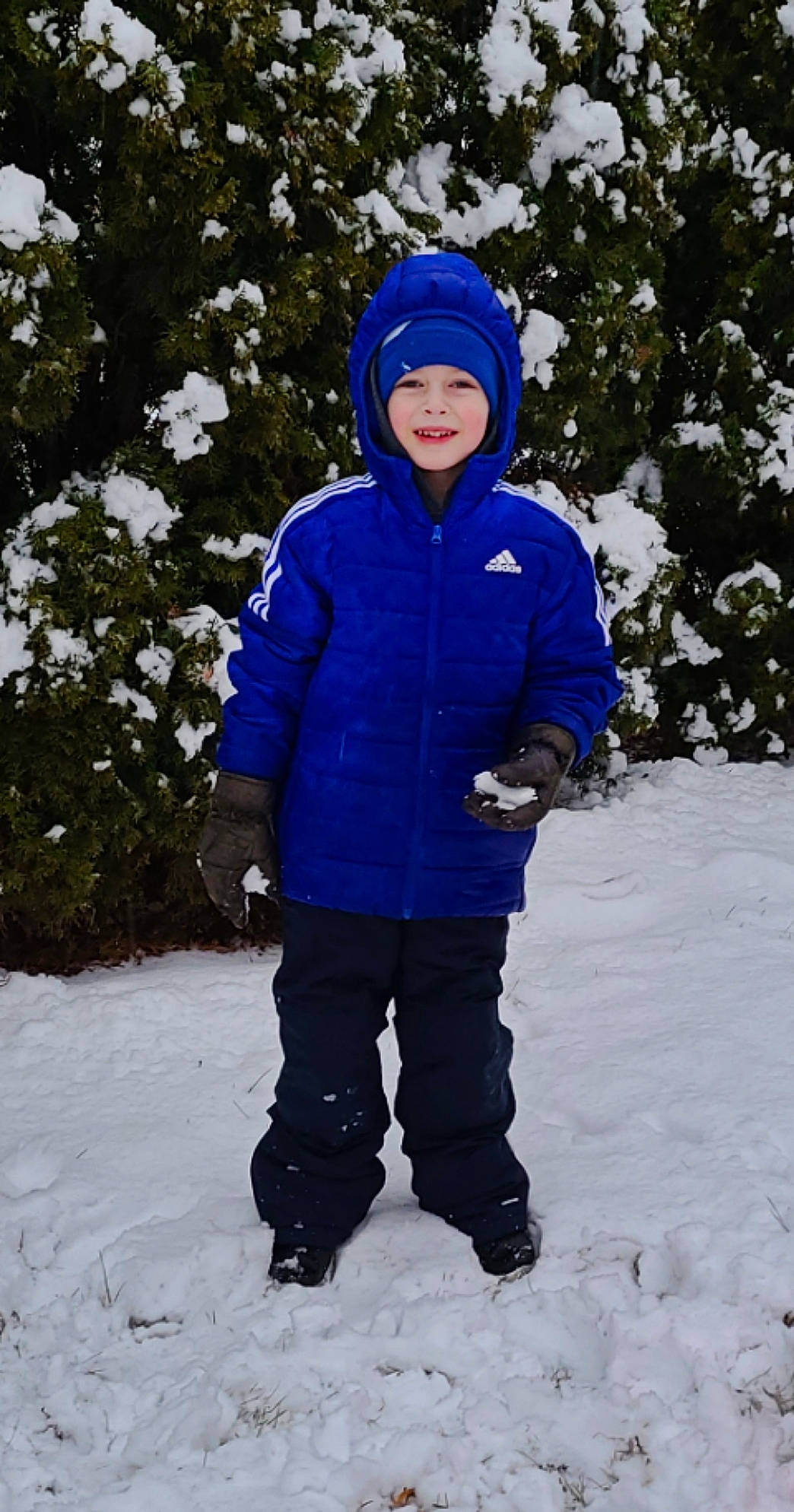Mason is registered to the contest to win money with this photo: cap, electric_blue, face, freezing, glove, happy, hat, headgear, headwear, hood, human_body, jacket, joy, leisure, person, plant, recreation, sleeve, slope, snow