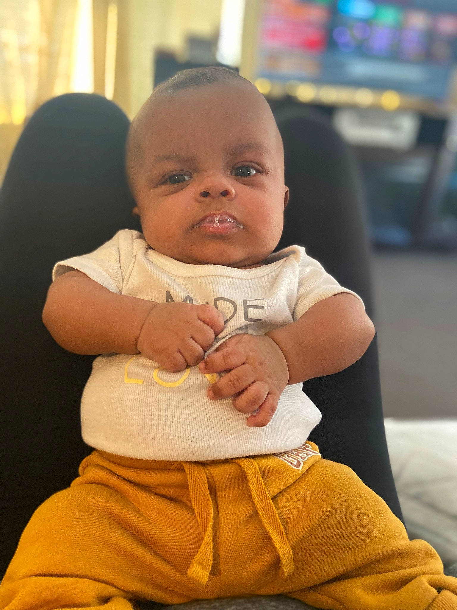 Harlem joined the competition — help win amazing prizes! abdomen, baby, baby_toddler_clothing, cheek, child, comfort, event, eye, finger, fun, happy, human_leg, knee, person, sitting, skin, sleeve, standing, thigh, toddler