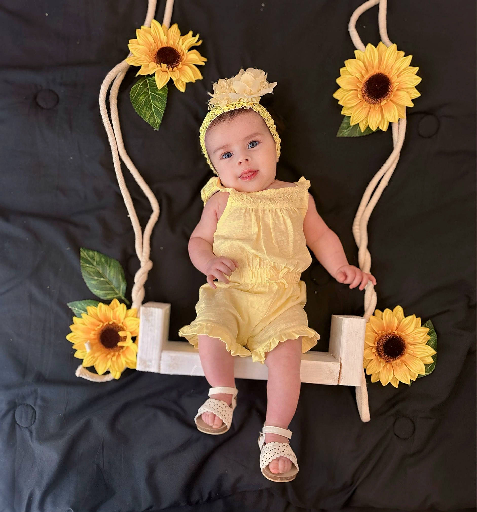 Mariafernanda is registered to the contest to win money with this photo: arm, baby, baby_products, baby_toddler_clothing, bouquet, child, cut_flowers, floral_design, flower, flowering_plant, hand, happy, headpiece, person, petal, plant, sleeve, textile, toddler, white