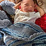 baby, sleeping, blanket, stuffed_animal, toddler, infant, cozy, soft_toy, child, resting, cute, portrait, indoors, clothing, knitted_blanket, peaceful, face, head, relaxation, comfort