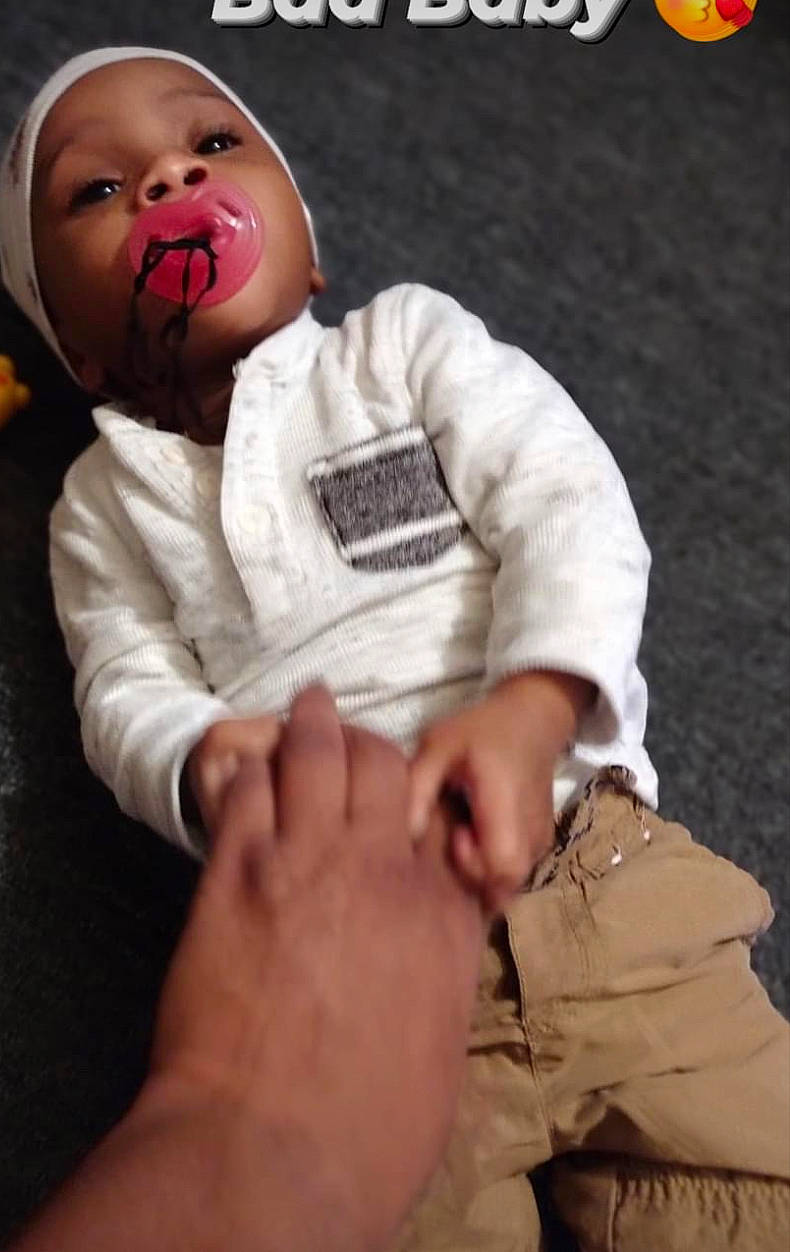 Egyptian is registered to the contest to win money with this photo: baby, baby_toddler_clothing, cheek, child, comfort, elbow, eye, finger, foot, gesture, hand, happy, human_leg, knee, mammal, person, sleeve, thigh, thumb, toddler