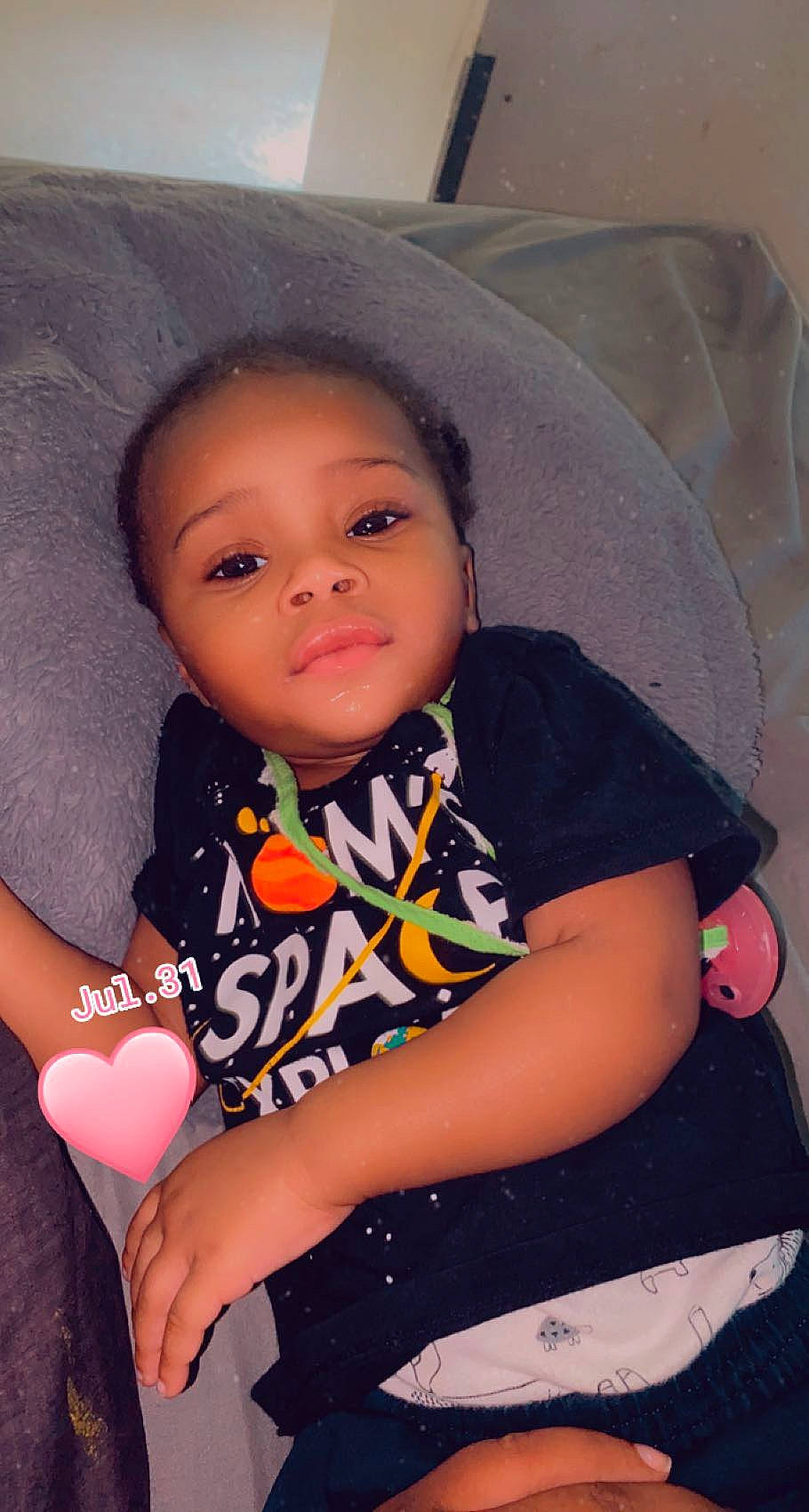 Egyptian is registered to the contest to win money with this photo: arm, baby_toddler_clothing, cheek, chin, eyebrow, facial_expression, finger, flash_photography, gesture, hairstyle, happy, iris, lip, neck, nose, person, pink, shoulder, skin, sleeve