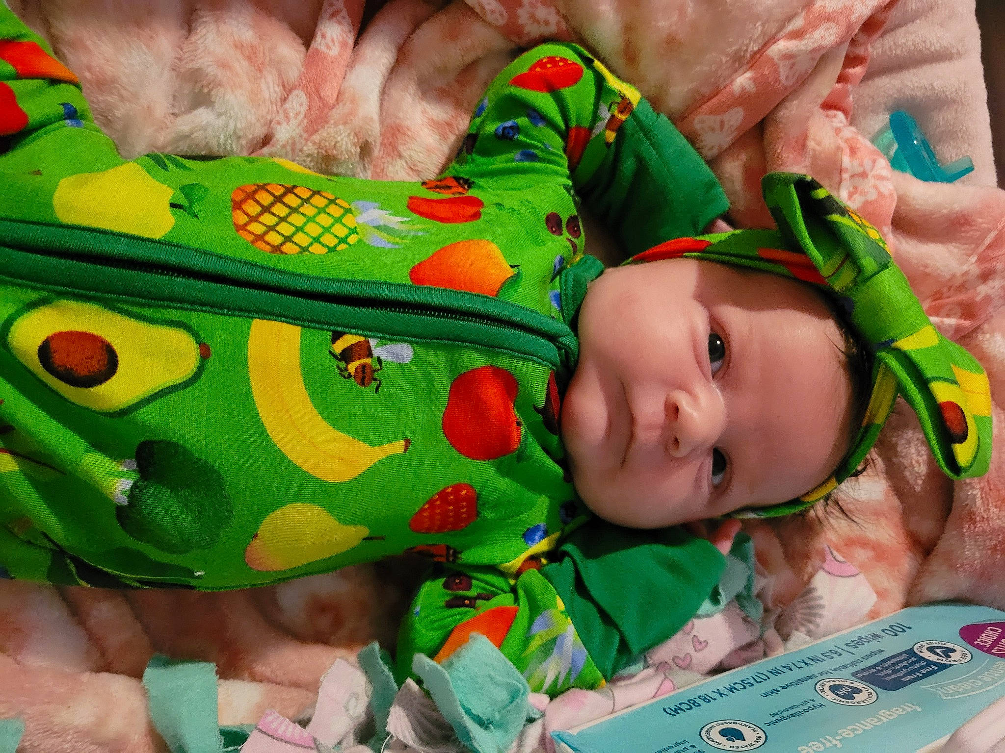 Carmen is registered to the contest to win money with this photo: baby, baby_products, baby_toddler_clothing, baby_toys, cheek, child, event, fictional_character, fur, green, happy, linens, mammal, pattern, person, play, room, skin, textile, toddler