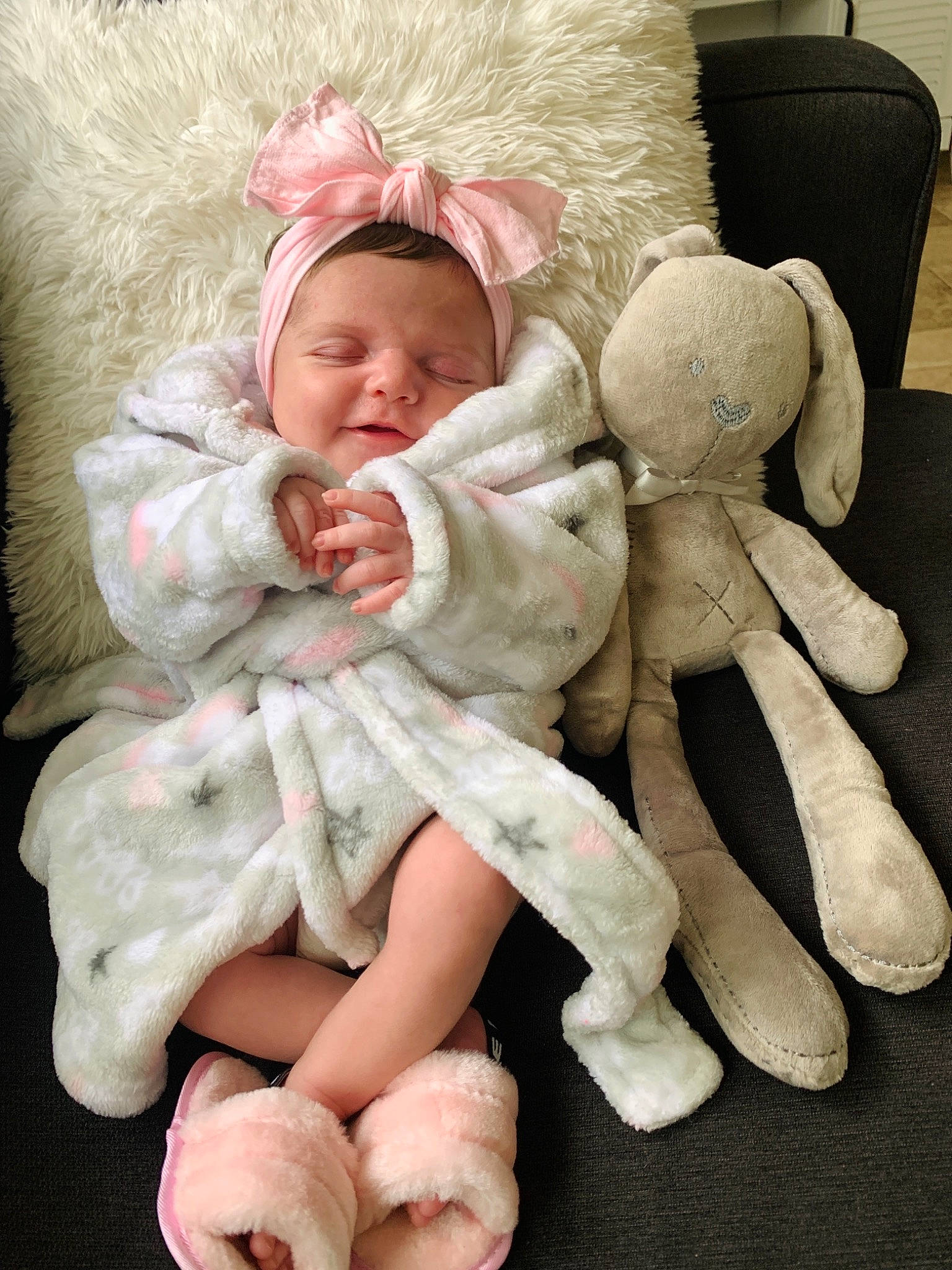 Brylee is registered to the contest to win money with this photo: arm, baby, baby_sleeping, baby_toddler_clothing, child, comfort, couch, eye, face, finger, foot, fur, gesture, happy, head, linens, person, skin, toddler, toy