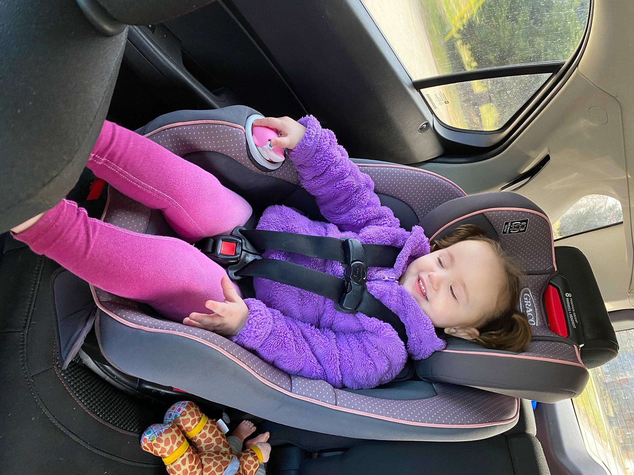 Hazel joined the competition — help win amazing prizes! auto_part, automotive_design, automotive_exterior, car, car_seat, car_seat_cover, comfort, head_restraint, joy, mode_of_transport, motor_vehicle, passenger, person, product, purple, seat_belt, steering_part, steering_wheel, toddler, vehicle
