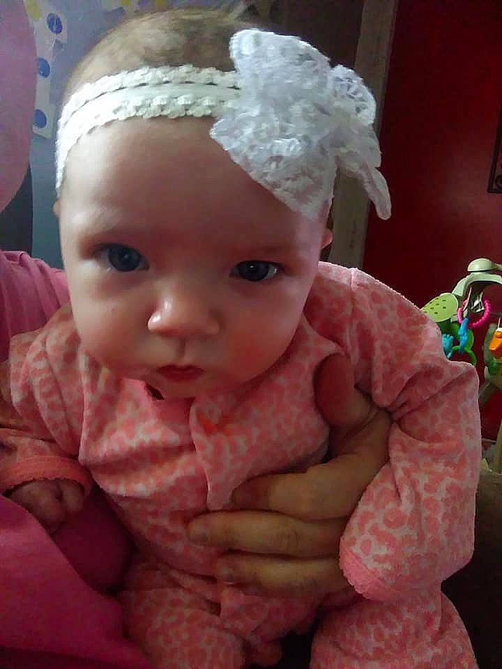 Ava is registered to the contest to win money with this photo: baby, cheek, child, ear, eye, face, forehead, head, headgear, lip, nose, person, pink, skin, toddler, toy