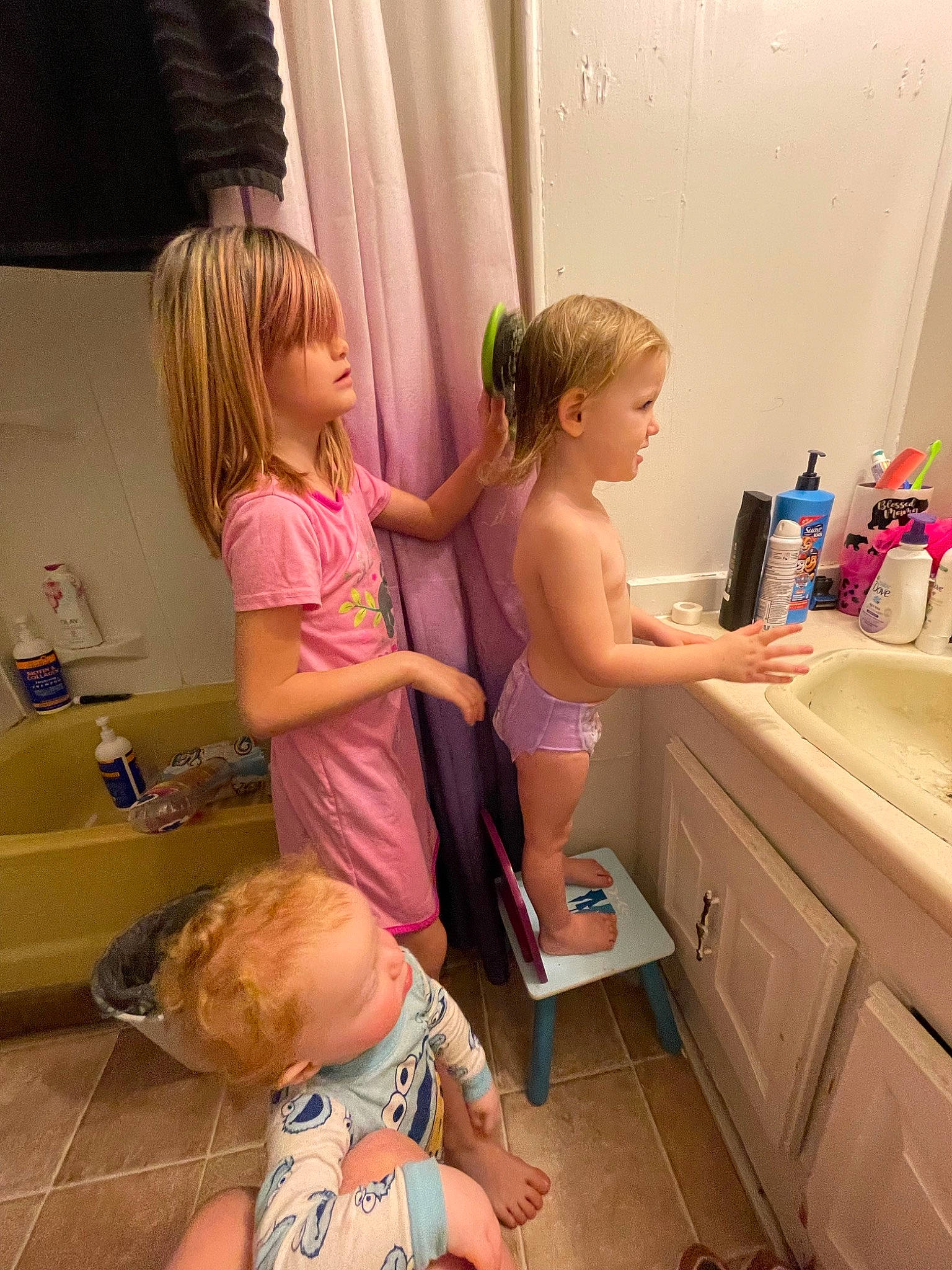 Kameron is registered to the contest to win money with this photo: bathroom, cabinetry, child, curtain, finger, floor, flooring, hair, hairstyle, happy, joint, leg, person, personal_care, pink, purple, shoulder, standing, thigh, thumb