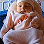 Iris participe au concours pour gagner de l'argent avec cette photo : baby, sleeping, pink_clothing, hat, cute, infant, cozy, pajamas, socks, child, portrait, indoors, soft_lighting, peaceful, resting, newborn, headwear, warm, comfort, closeup