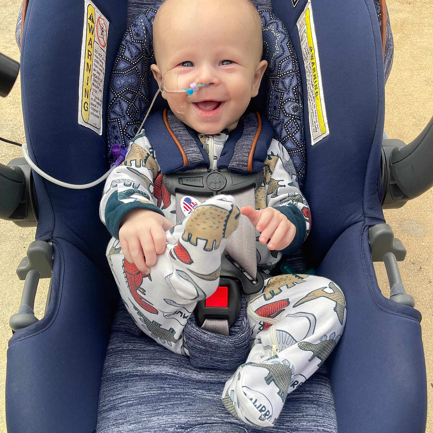 Koen joined the competition — help win amazing prizes! baby, car, clothing, coat, cushion, face, furniture, happy, head, homedecor, jacket, pants, person, photography, portrait, sitting, sleeping, smile, transportation, vehicle