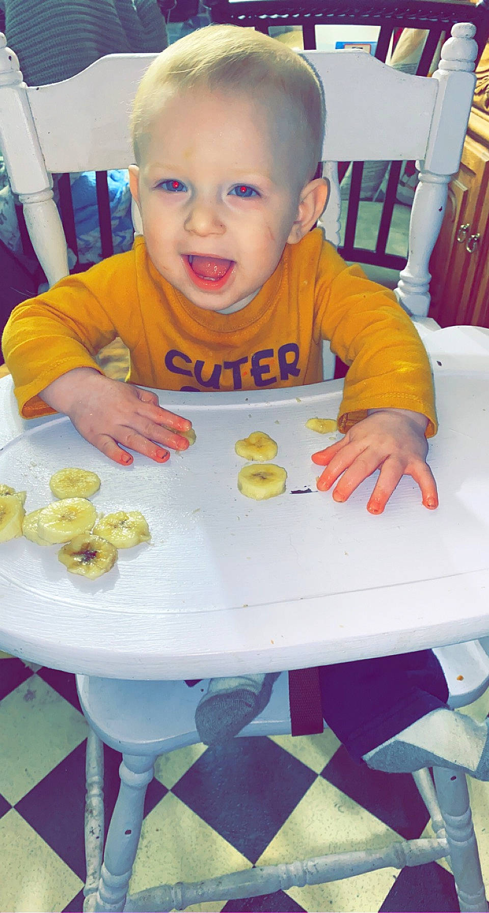 Clyde is registered to the contest to win money with this photo: baby, baby_toddler_clothing, chair, cheek, child, face, facial_expression, food_craving, furniture, head, person, photograph, product, sharing, skin, sleeve, smile, table, toddler, white