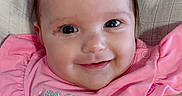 Tatum joined the competition — help win amazing prizes! baby, child, smile, pink_clothing, face, infant, cute, happy, eyes, portrait, person, young_child, sitting, apparel, textile, close_up, skin, hair, indoors, cheek
