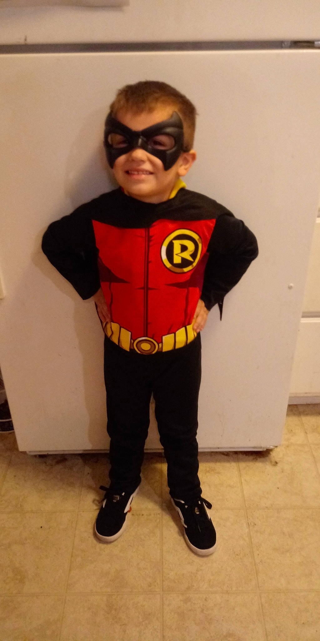Gunner is registered to the contest to win money with this photo: batman, costume, fictional_character, headwear, hero, joy, justice_league, outerwear, person, robin, smile, suit_actor, superhero, t_shirt, yellow