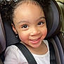 Miliani Rose joined the competition — help win amazing prizes! child, smiling, car_seat, curly_hair, seatbelt, indoor, portrait, happy, toddler, girl, clothing, earrings, car_interior, safety, cute, face, person, young, seat, window