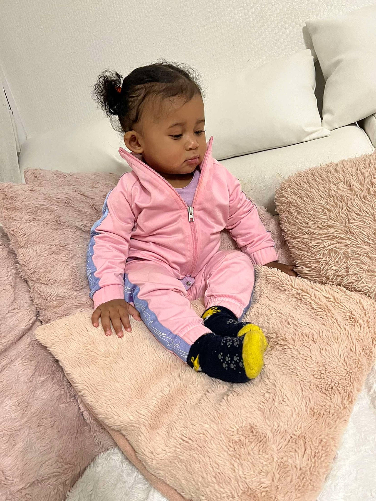 Heylie participe au concours pour gagner de l'argent avec cette photo : arm, baby, baby_toddler_clothing, child, comfort, couch, flooring, fun, linens, magenta, outerwear, person, product, purple, room, sitting, sleeve, stuffed_toy, textile, toddler