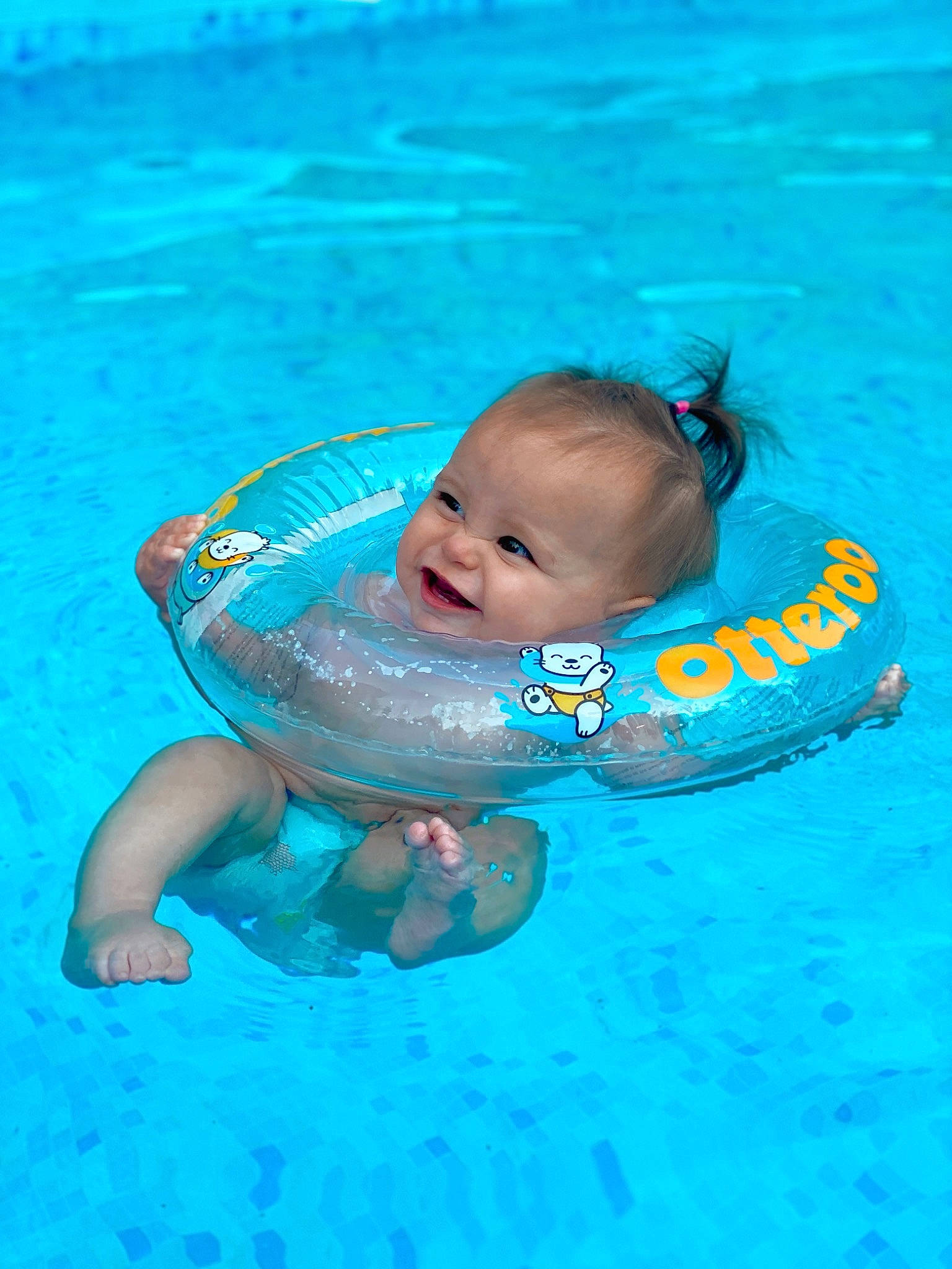 Jojo is registered to the contest to win money with this photo: aqua, azure, baby, baby_float, baby_products, baby_toddler_clothing, bathing, blue, child, fluid, fun, games, happy, leisure, person, personal_protective_equipment, recreation, swimmer, swimming_pool, toddler