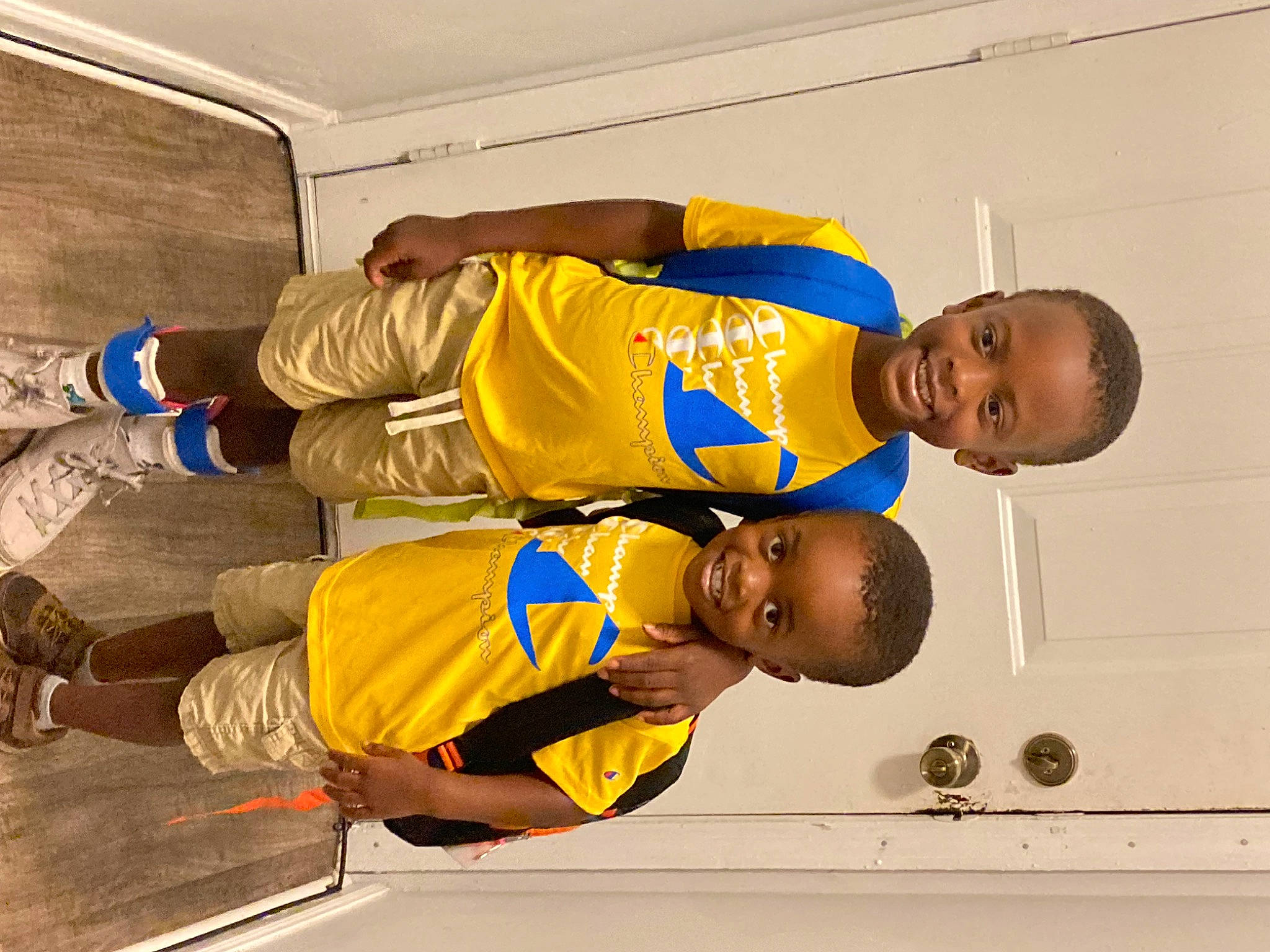 Bentley is registered to the contest to win money with this photo: cleanliness, door, elbow, happy, joy, person, sleeve, smile, sports_jersey, t_shirt, toddler, wrist