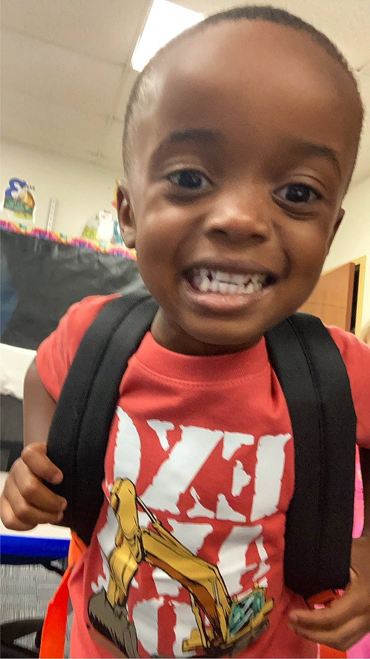 Bentley is registered to the contest to win money with this photo: baby, cheek, child, ear, eyelash, forehead, fun, happy, jaw, joy, laugh, lip, mouth, nose, person, room, skin, smile, snake, t_shirt