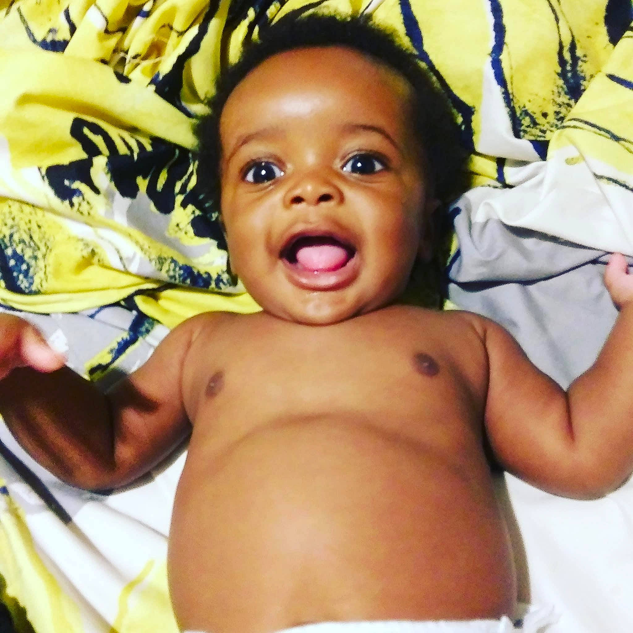 Bentley is registered to the contest to win money with this photo: abdomen, baby, black_hair, cheek, chest, child, facial_expression, happy, mouth, muscle, nose, person, skin, smile, toddler