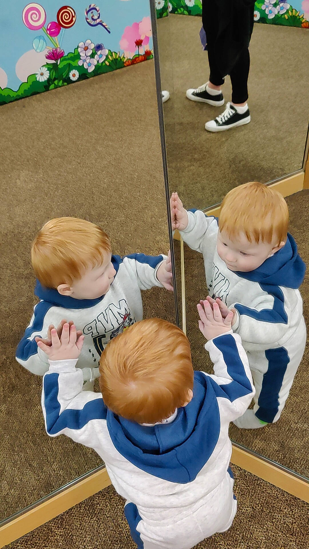 Caiden is registered to the contest to win money with this photo: baby, baby_toddler_clothing, child, flooring, fun, gesture, grass, green, hairstyle, hand, joint, leisure, people, person, sharing, shoe, sitting, sleeve, sneakers, toddler