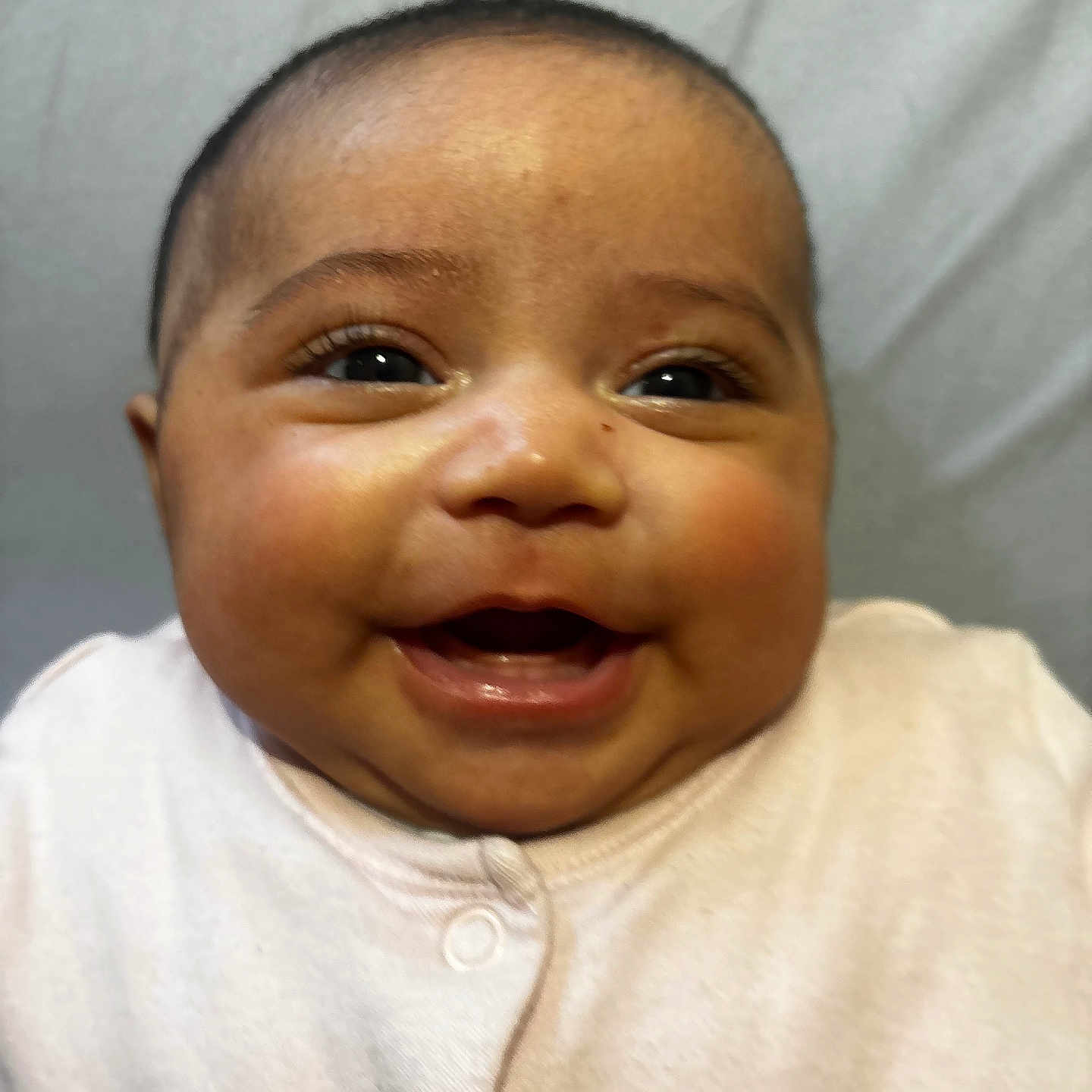 Zeyna Rose is registered to the contest to win money with this photo: baby, cheeks, child, closeup, clothing, cute, expression, eyes, face, happy, head, indoors, infant, mouth, newborn, onesie, person, portrait, skin, smiling