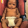 baby, infant, car_seat, diaper, child, serious, indoors, person, seat_belt, foot, hand, skin, head, black_hair, expression, cute, young, toddler, seat, floor_tiles