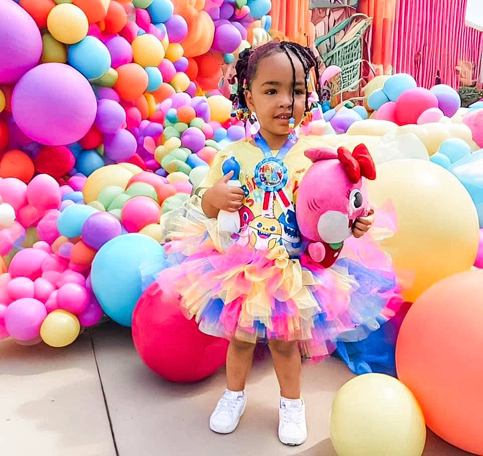 Liberty is registered to the contest to win money with this photo: balloon, beauty, child, entertainment, event, fun, happy, inflatable, leisure, magenta, organ, party_supply, people, person, pink, play, recreation, snapshot, toddler, toy