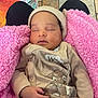 Jakiylah is registered to the contest to win money with this photo: baby, blanket, child, clothing, cozy, cute, floor, hand, hat, indoors, infant, person, pink, portrait, relaxing, resting, sleeping, soft, tiled_floor, warm