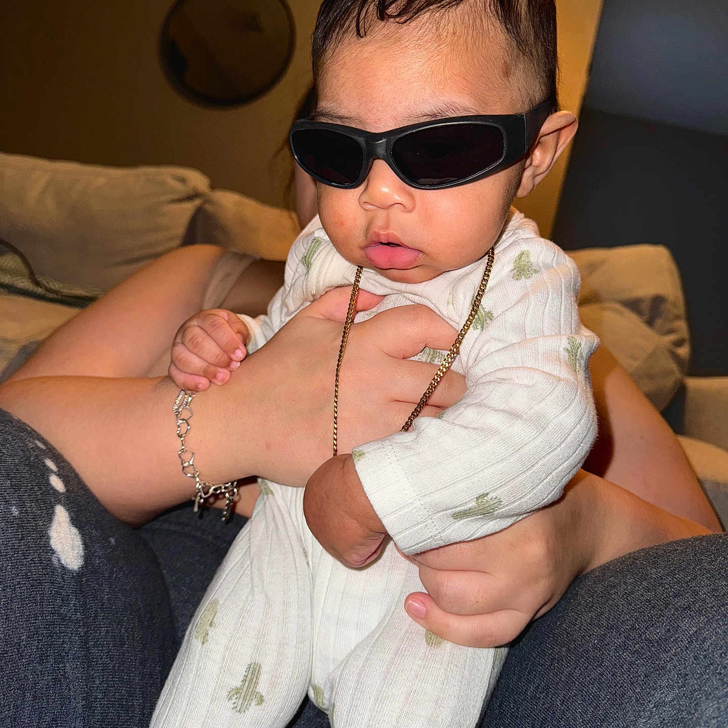 Kai joined the competition — help win amazing prizes! accessories, baby, bodypart, clothing, couch, face, finger, furniture, glasses, hand, head, homedecor, jewelry, necklace, pants, person, photography, portrait, sitting, sunglasses