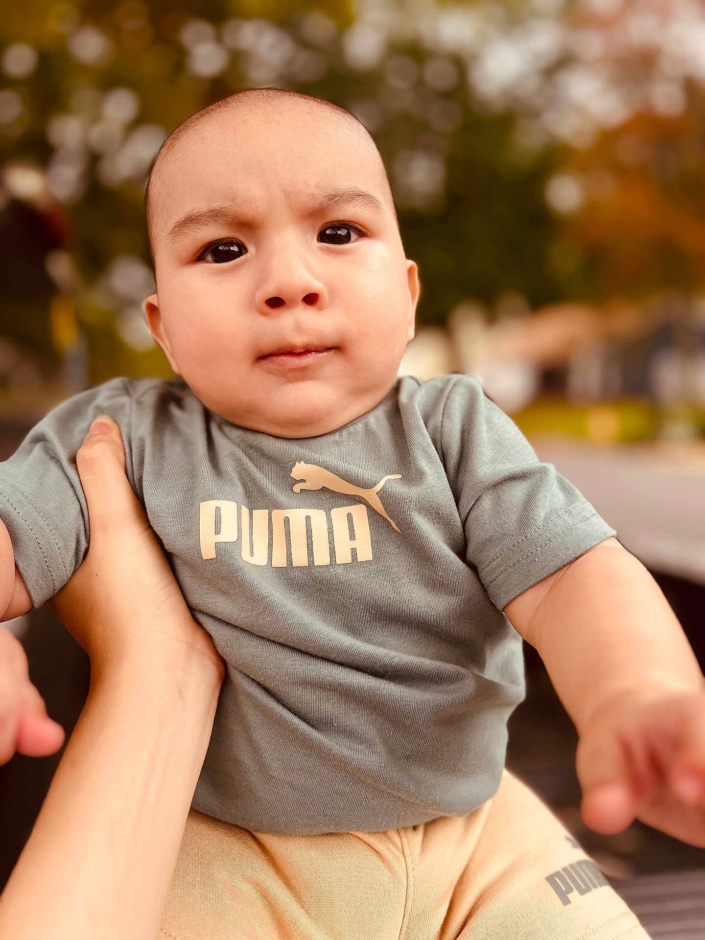 Iker joined the competition — help win amazing prizes! baby, child, puma, tshirt, pants, hand, outdoor, portrait, face, person, clothing, expression, serious, skin, short_sleeve, holding, autumn, blurred_background, nature, daylight