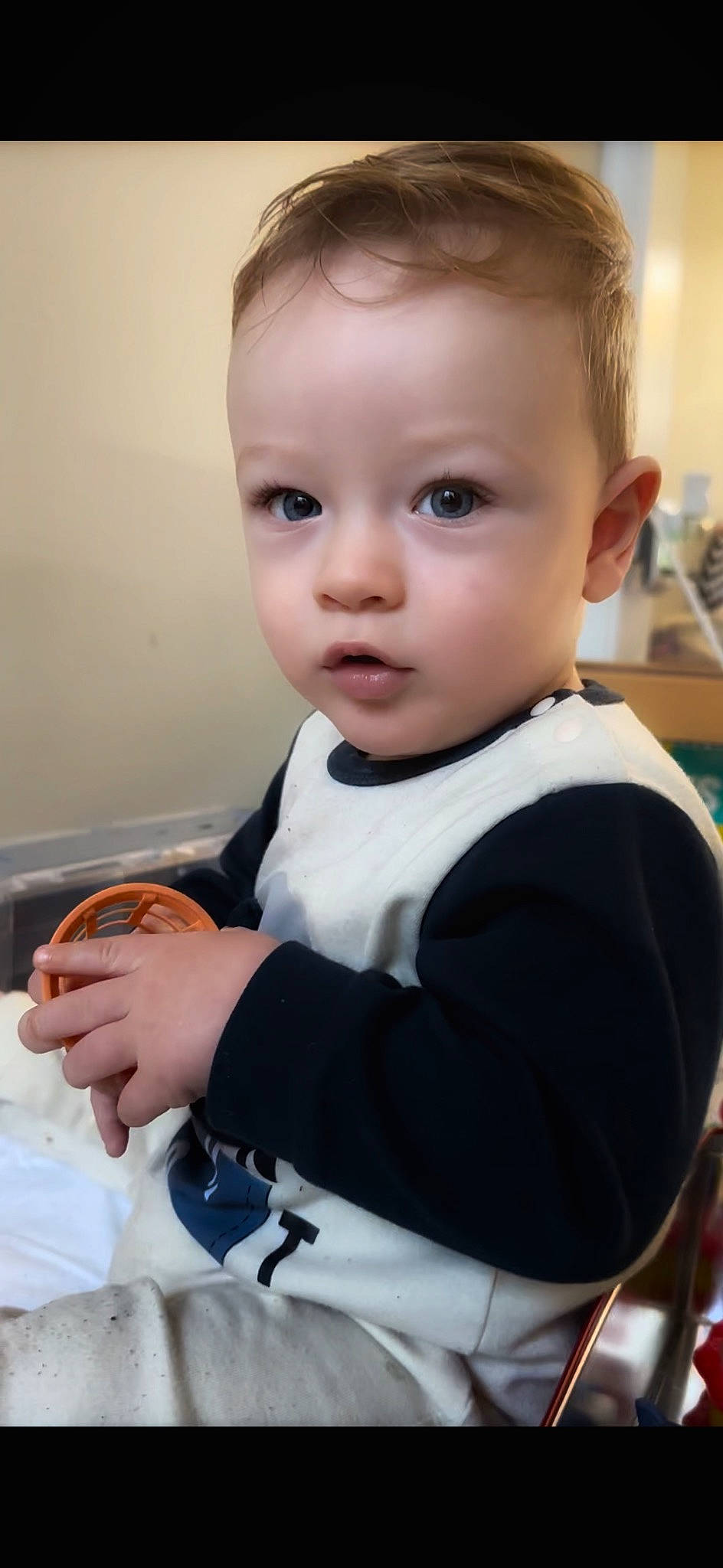 Stefan is registered to the contest to win money with this photo: baby, baby_toddler_clothing, chair, cheek, child, child_model, collar, comfort, formal_wear, gesture, happy, iris, lip, person, portrait_photography, room, sitting, skin, sleeve, t_shirt