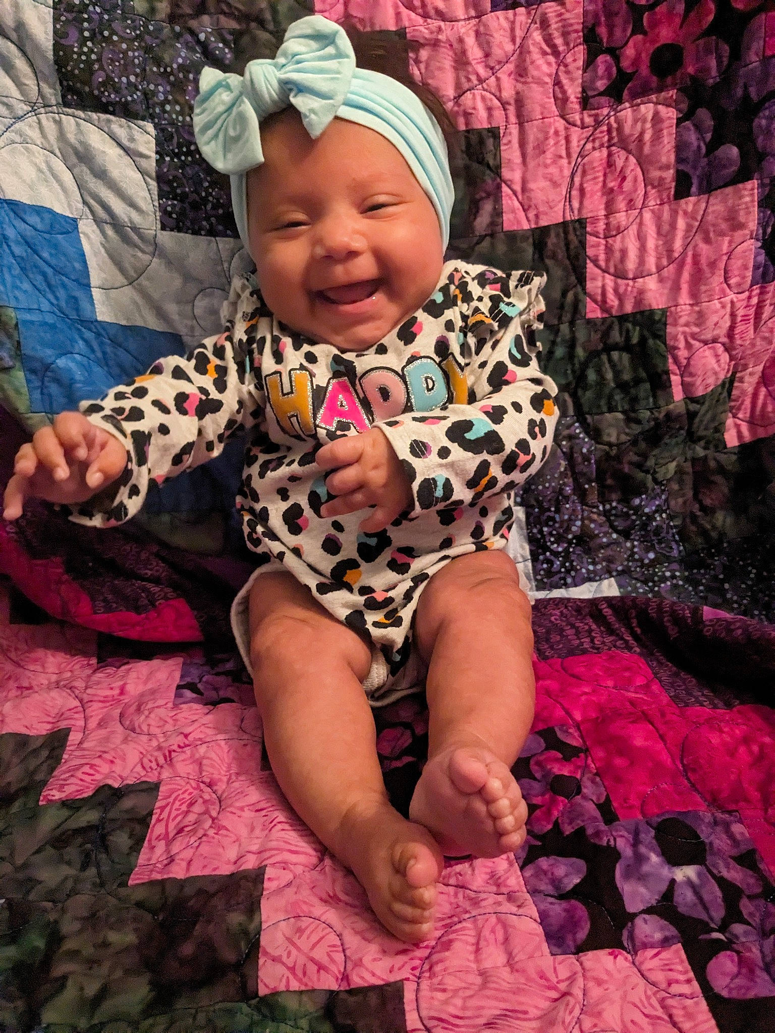A'Mya joined the competition — help win amazing prizes! baby, baby_toddler_clothing, baseball_cap, cap, child, eye, face, facial_expression, fun, happy, headwear, joy, magenta, pattern, person, pink, purple, skin, smile, t_shirt