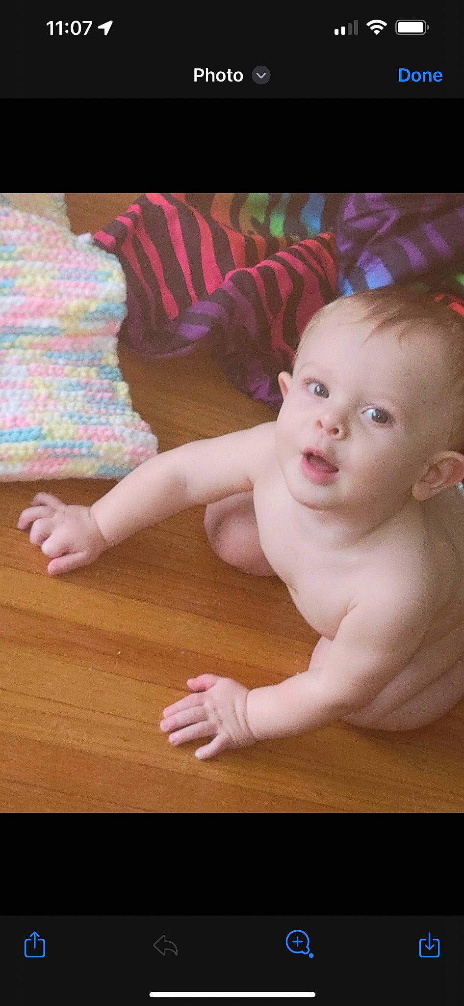 Dean is registered to the contest to win money with this photo: arm, baby, baby_toddler_clothing, cheek, eye, finger, flash_photography, floor, flooring, gesture, hand, happy, head, human_body, joint, person, pink, skin, thumb, toddler