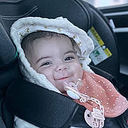 Leya a rejoint le concours — aidez-le/la à gagner de superbes lots ! baby, bonnet, cap, car, clothing, coat, cushion, face, happy, hat, head, homedecor, hood, jacket, person, photography, portrait, smile, transportation, vehicle