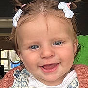 Callie-Anne joined the competition — help win amazing prizes! baby, child, girl, smiling, pigtails, hair_bows, denim_overall, pink_sweater, indoor, portrait, cute, happy, face, blue_eyes, young_child, closeup, person, headshot, toddler, clothing