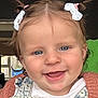 baby, child, girl, smiling, pigtails, hair_bows, denim_overall, pink_sweater, indoor, portrait, cute, happy, face, blue_eyes, young_child, closeup, person, headshot, toddler, clothing