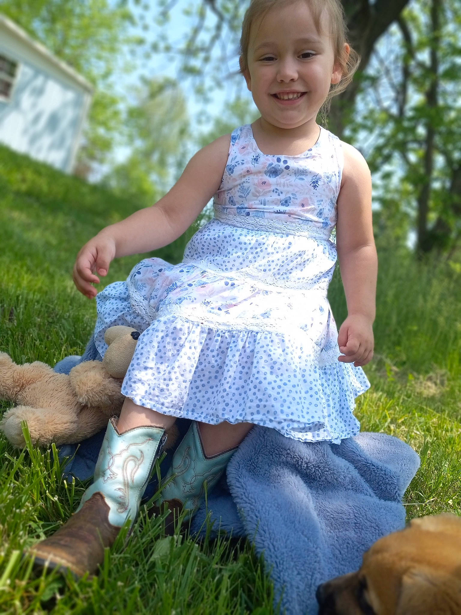 Octavia is registered to the contest to win money with this photo: baby_toddler_clothing, blond, child, day_dress, dress, electric_blue, fawn, fun, grass, grassland, happy, joy, mammal, meadow, pattern, people_in_nature, person, plant, sitting, smile