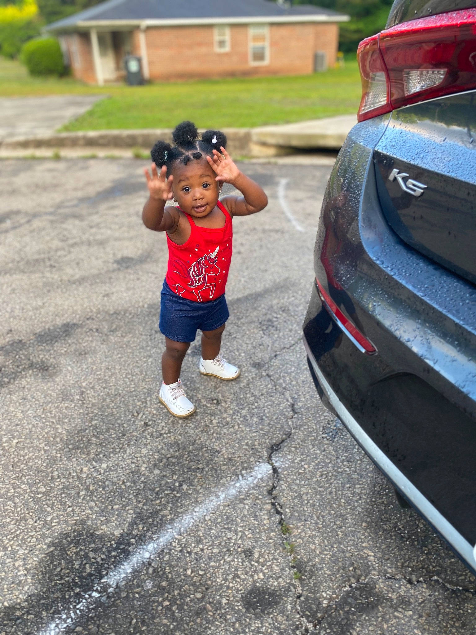 Zendaya joined the competition — help win amazing prizes! asphalt, automotive_design, automotive_exterior, automotive_lighting, automotive_tire, bumper, car, grille, hood, leisure, motor_vehicle, parking, person, personal_luxury_car, plant, road, shorts, surprise, toddler, trunk