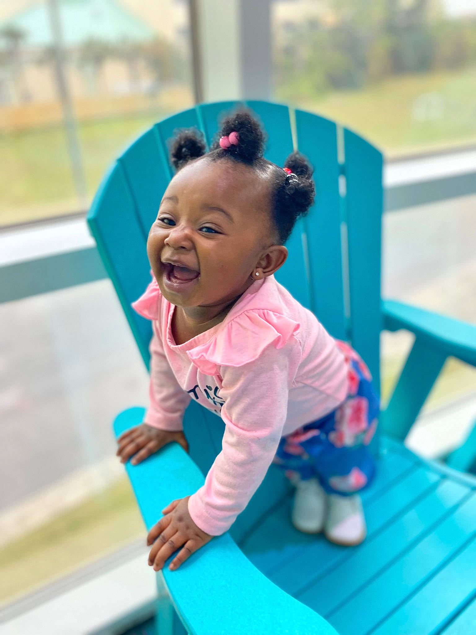 Zendaya is registered to the contest to win money with this photo: baby, baby_toddler_clothing, blue, child, city, electric_blue, fun, grass, green, happy, leisure, magenta, outdoor_play_equipment, person, play, playground_slide, recreation, sitting, smile, toddler