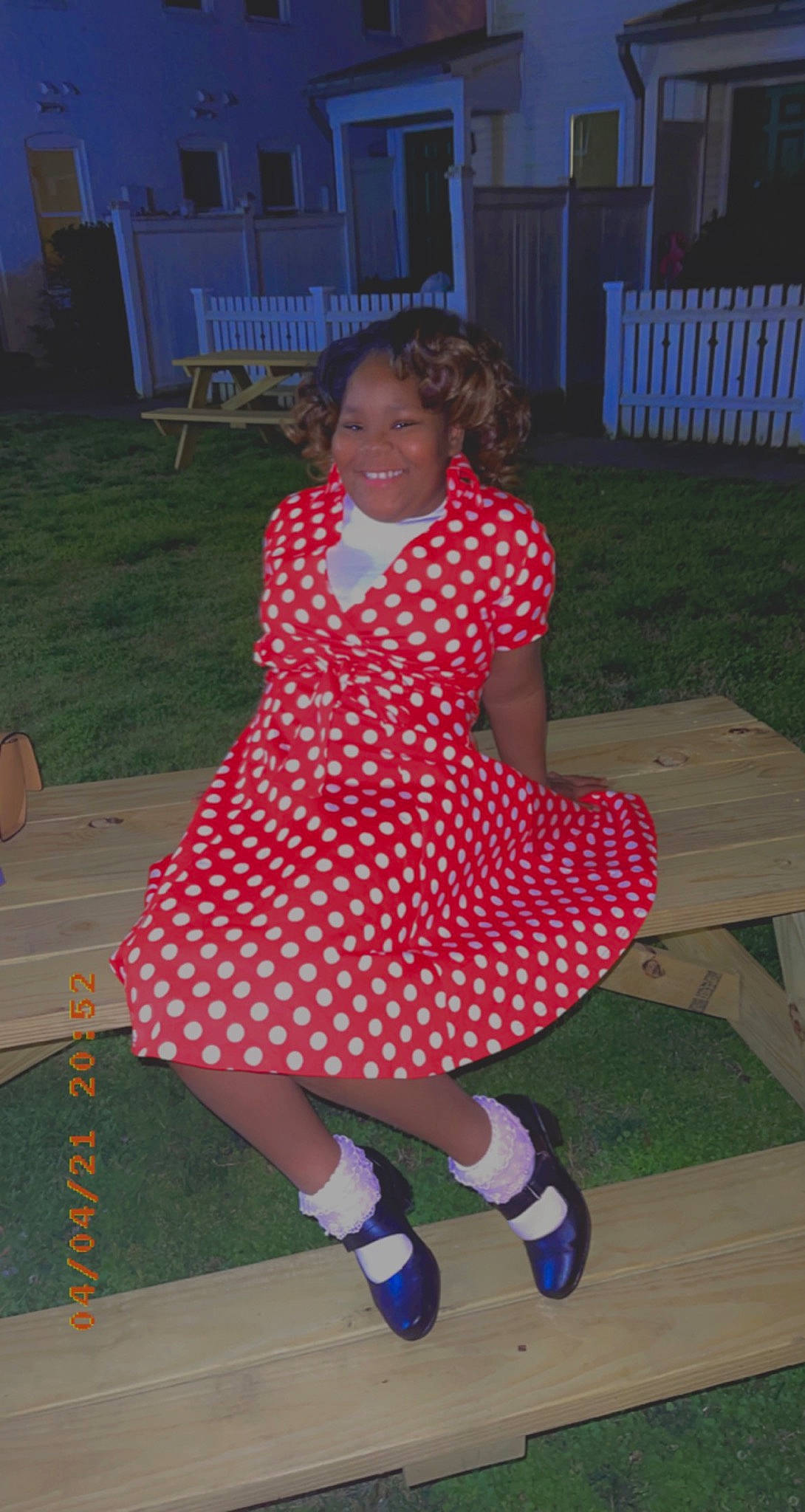 Leah is registered to the contest to win money with this photo: carmine, dress, entertainment, event, fashion_design, flooring, foot, fun, grass, hair, human_leg, joy, knee, leisure, magenta, pattern, person, pink, recreation, smile